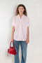 The Cuffed Sleeve Shirt by Acne Studios is a button-up shirt crafted from 100% organic cotton, featuring short tailored cuff sleeves