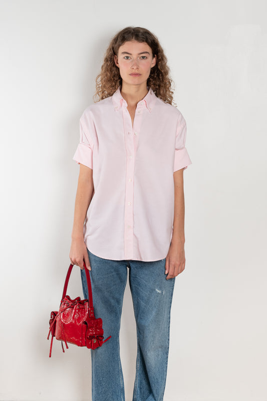The Cuffed Sleeve Shirt by Acne Studios is a button-up shirt crafted from 100% organic cotton, featuring short tailored cuff sleeves