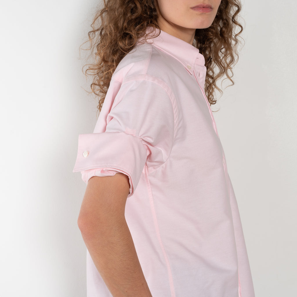 The Cuffed Sleeve Shirt by Acne Studios is a button-up shirt crafted from 100% organic cotton, featuring short tailored cuff sleeves