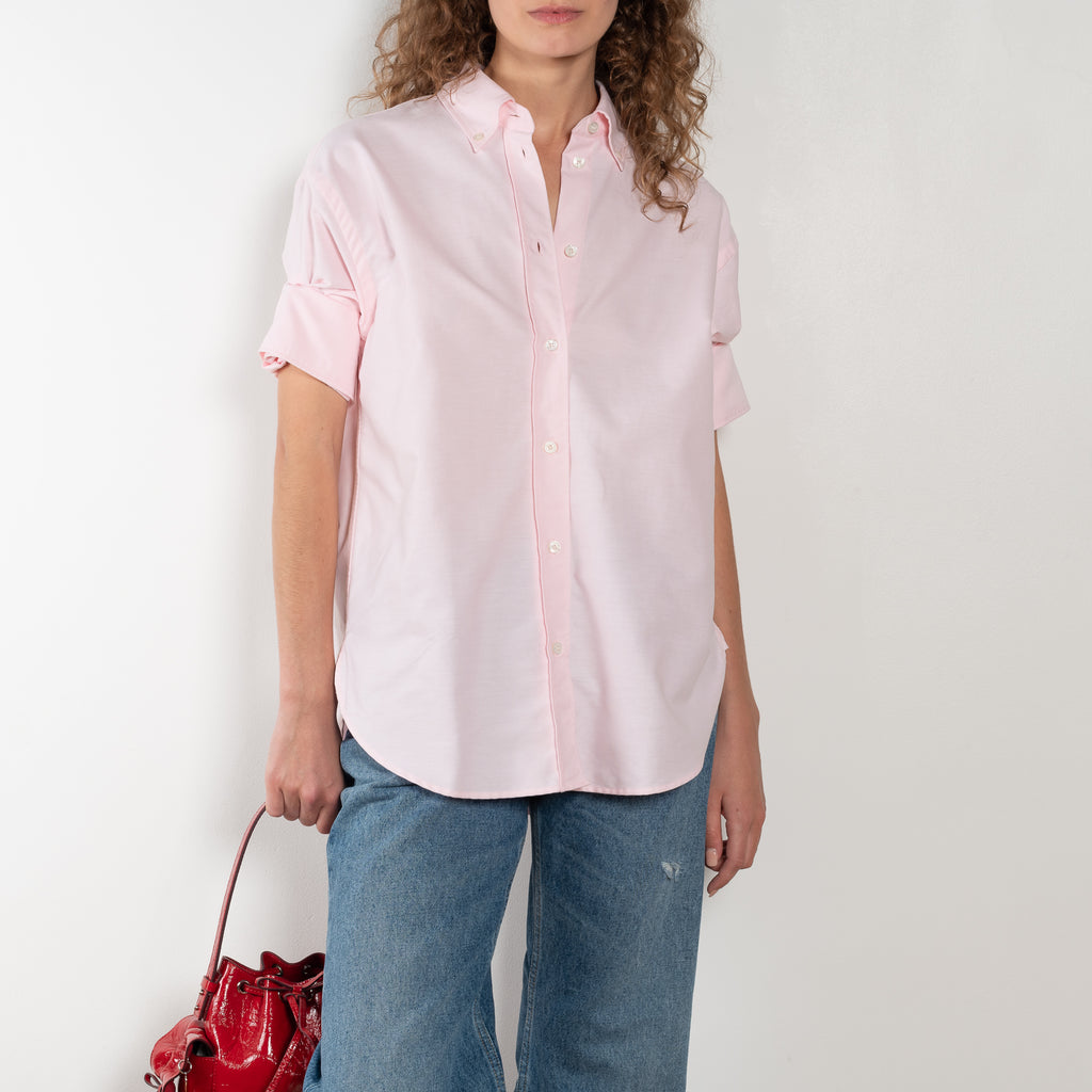 The Cuffed Sleeve Shirt by Acne Studios is a button-up shirt crafted from 100% organic cotton, featuring short tailored cuff sleeves