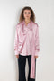 The Layered Satin Shirt by Acne Studios is a button-up shirt blouse crafted from lightweight, fluid satin fabric, featuring constructed scarf detailing