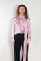 The Layered Satin Shirt by Acne Studios is a button-up shirt blouse crafted from lightweight, fluid satin fabric, featuring constructed scarf detailing