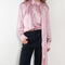 The Layered Satin Shirt by Acne Studios is a button-up shirt blouse crafted from lightweight, fluid satin fabric, featuring constructed scarf detailing