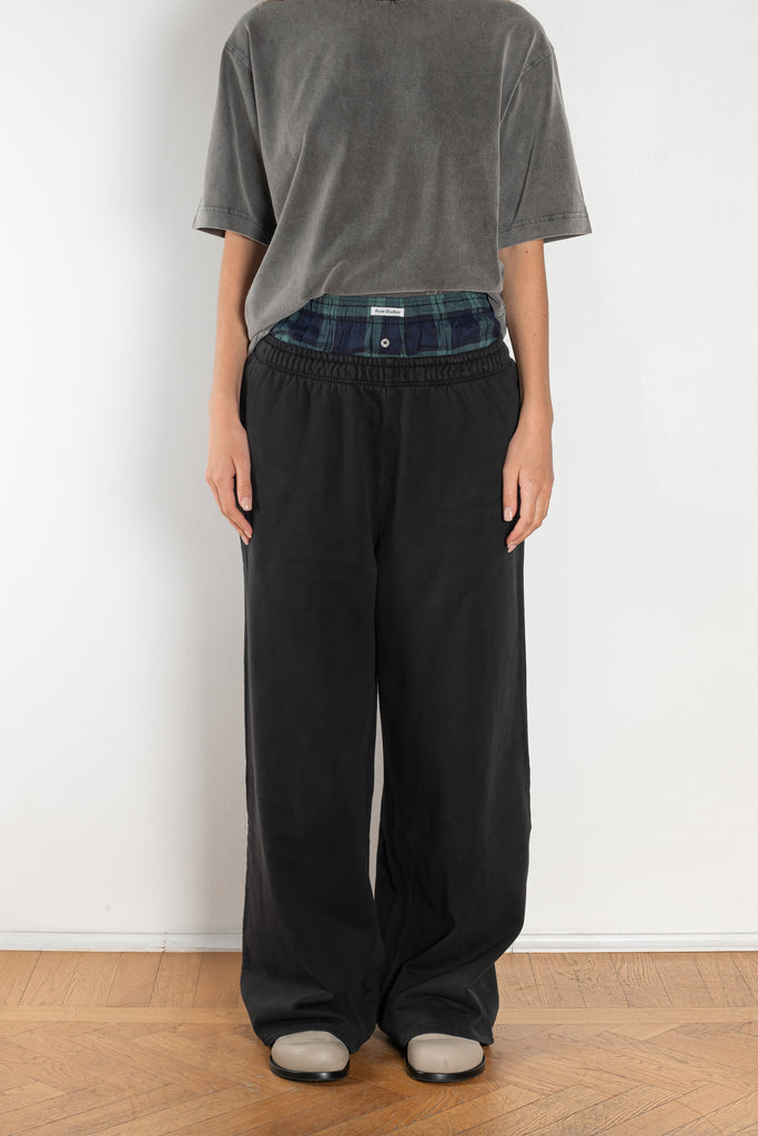 The Loose fit trousers by Acne Studios are relaxed joggers with an integrated boxer. Cut to a loose fit, wide leg and long length.