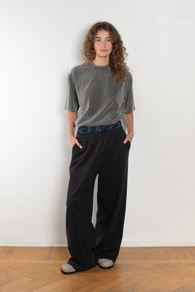 The Loose fit trousers by Acne Studios are relaxed joggers with an integrated boxer. Cut to a loose fit, wide leg and long length.