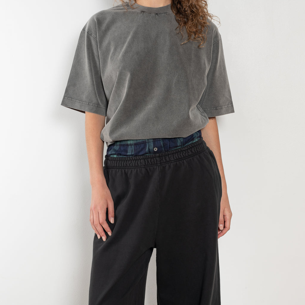 The Loose fit trousers by Acne Studios are relaxed joggers with an integrated boxer. Cut to a loose fit, wide leg and long length.