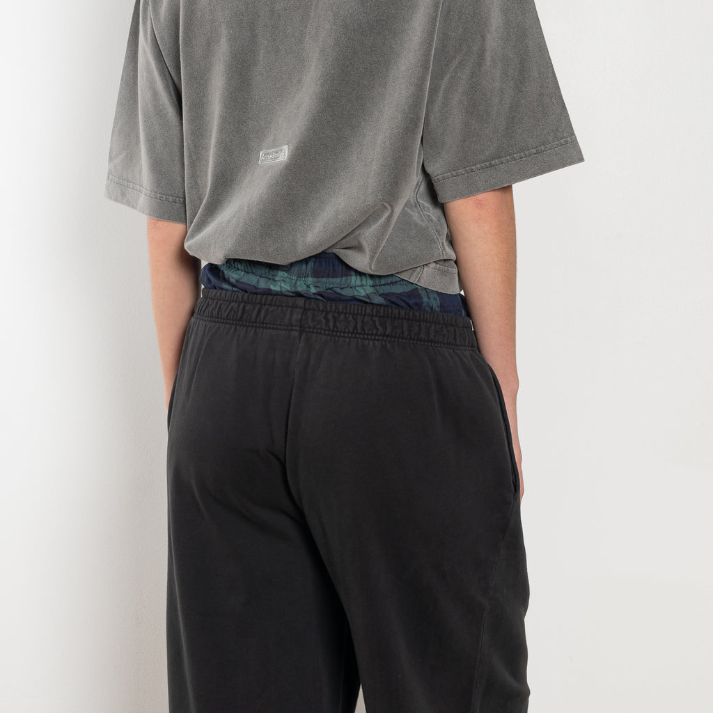 The Loose fit trousers by Acne Studios are relaxed joggers with an integrated boxer. Cut to a loose fit, wide leg and long length.