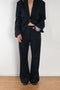 The Pinstripe Trouser by Acne Studios feature a pinstripe pattern crafted from a soft fluid fabric. Cut to a regular fit with a mid-waist, bootcut leg and extra long length.