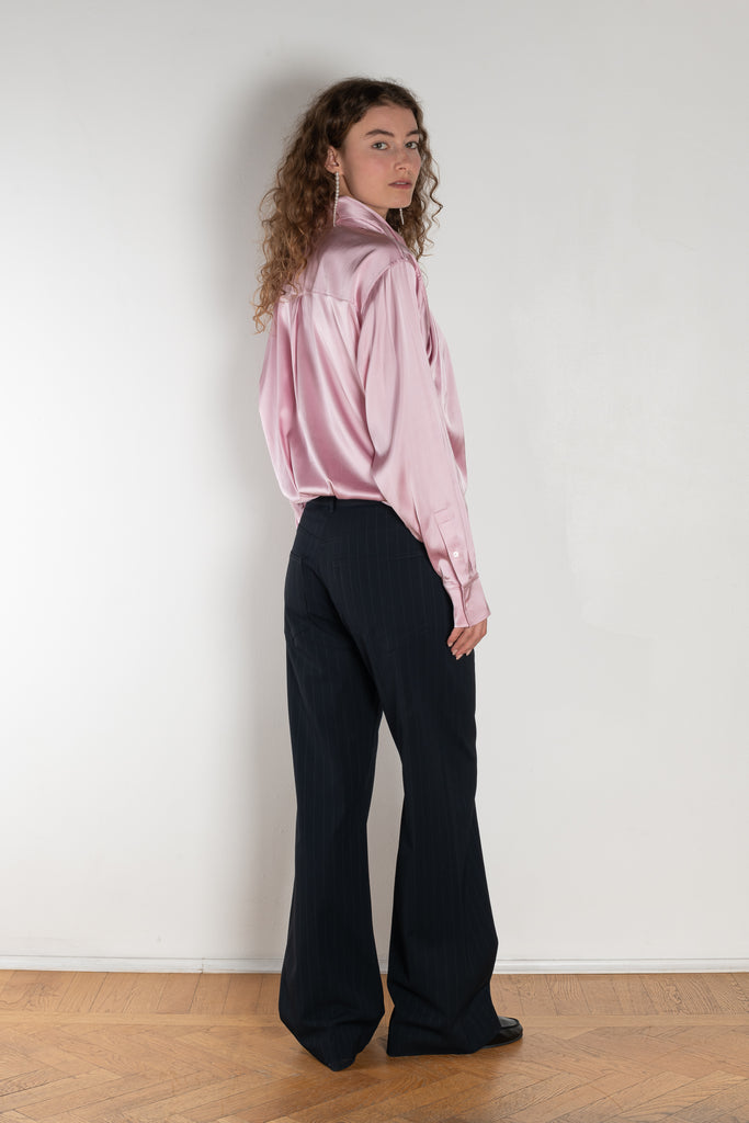 The Pinstripe Trouser by Acne Studios feature a pinstripe pattern crafted from a soft fluid fabric. Cut to a regular fit with a mid-waist, bootcut leg and extra long length.