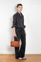 The 2021 Loose Fit Jeans by Acne Studios are cut to a loose fit with mid-waist, wide leg and long length