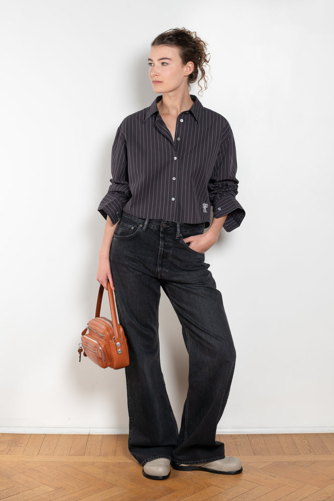 The 2021 Loose Fit Jeans by Acne Studios are cut to a loose fit with mid-waist, wide leg and long length