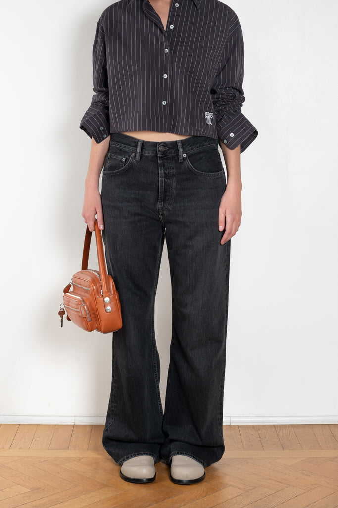The 2021 Loose Fit Jeans by Acne Studios are cut to a loose fit with mid-waist, wide leg and long length