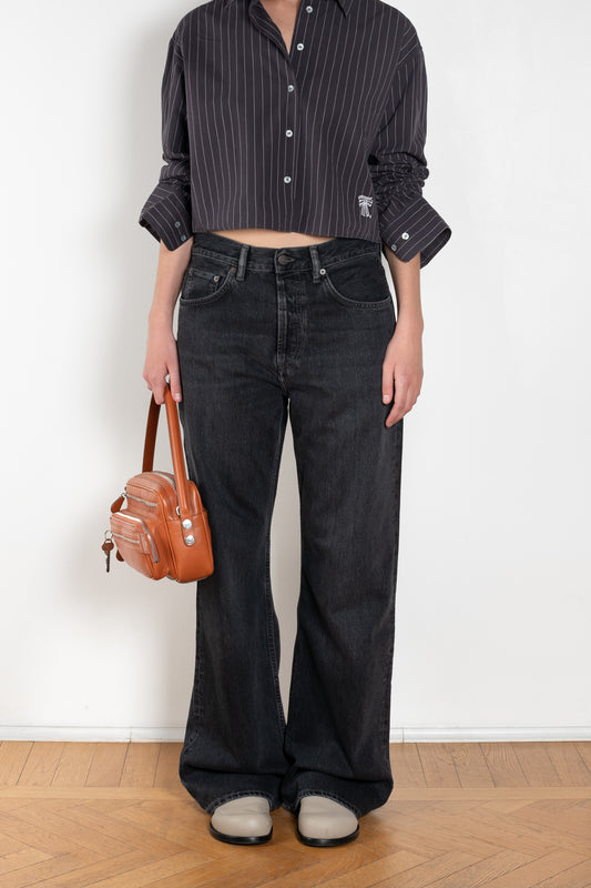 The 2021 Loose Fit Jeans by Acne Studios are cut to a loose fit with mid-waist, wide leg and long length
