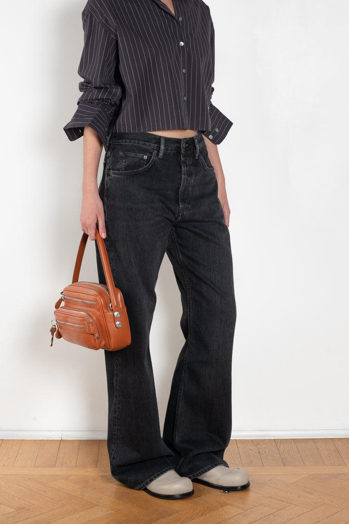 The 2021 Loose Fit Jeans by Acne Studios are cut to a loose fit with mid-waist, wide leg and long length