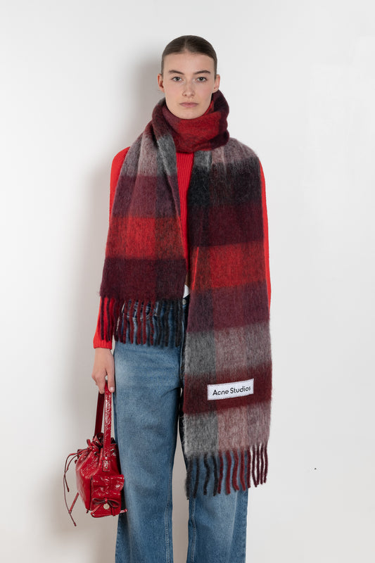 The Mohair Checked Scarf by Acne Studios is crafted from a wool mohair blend detailed with an embroidered logo label.