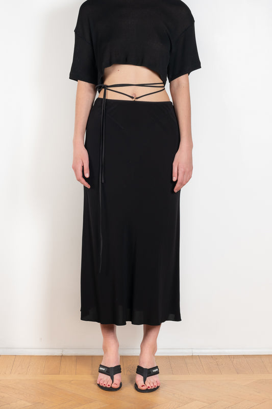The Voleta Midi Skirt by Anna October is a signature summer skirt with a bias cut and delicate straps on the hips