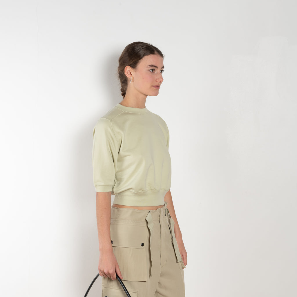 The Half Sleeved Sweat by Auralee is a cropped sweater with a half sleeve in a high quality ultra fine cotton