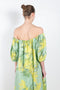 The Dress Zaza by Bernadette is a long off-the-shoulder dress in linen with a delicate mimosa print