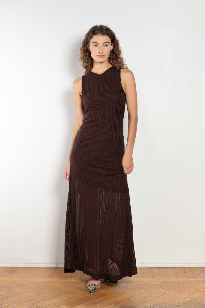 The Spacia Tank Dress by Bite is crafted from a soft, lustrous, and subtly textured jersey, featuring a sleek double bodice that flares into a single-layer skirt below the hips