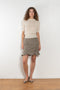 The Arista Flared Skirt by Bite is crafted from high-quality houndstooth check wool with a subtle fluted hem and an invisible side seam closure