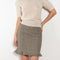 The Arista Flared Skirt by Bite is crafted from high-quality houndstooth check wool with a subtle fluted hem and an invisible side seam closure