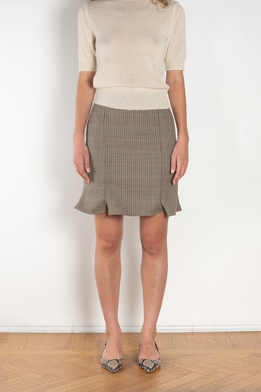 The Arista Flared Skirt by Bite is crafted from high-quality houndstooth check wool with a subtle fluted hem and an invisible side seam closure