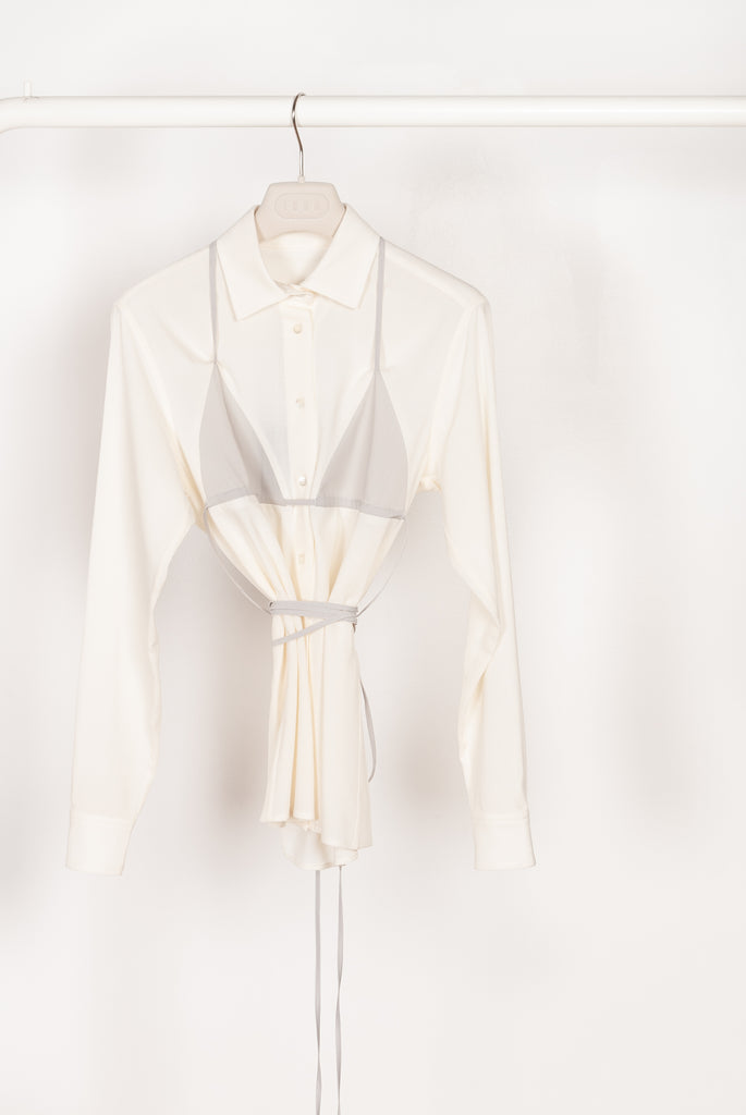 The Bikini Shirt by Botter is a cream shirt with a integrated bikini detail to tie in the back