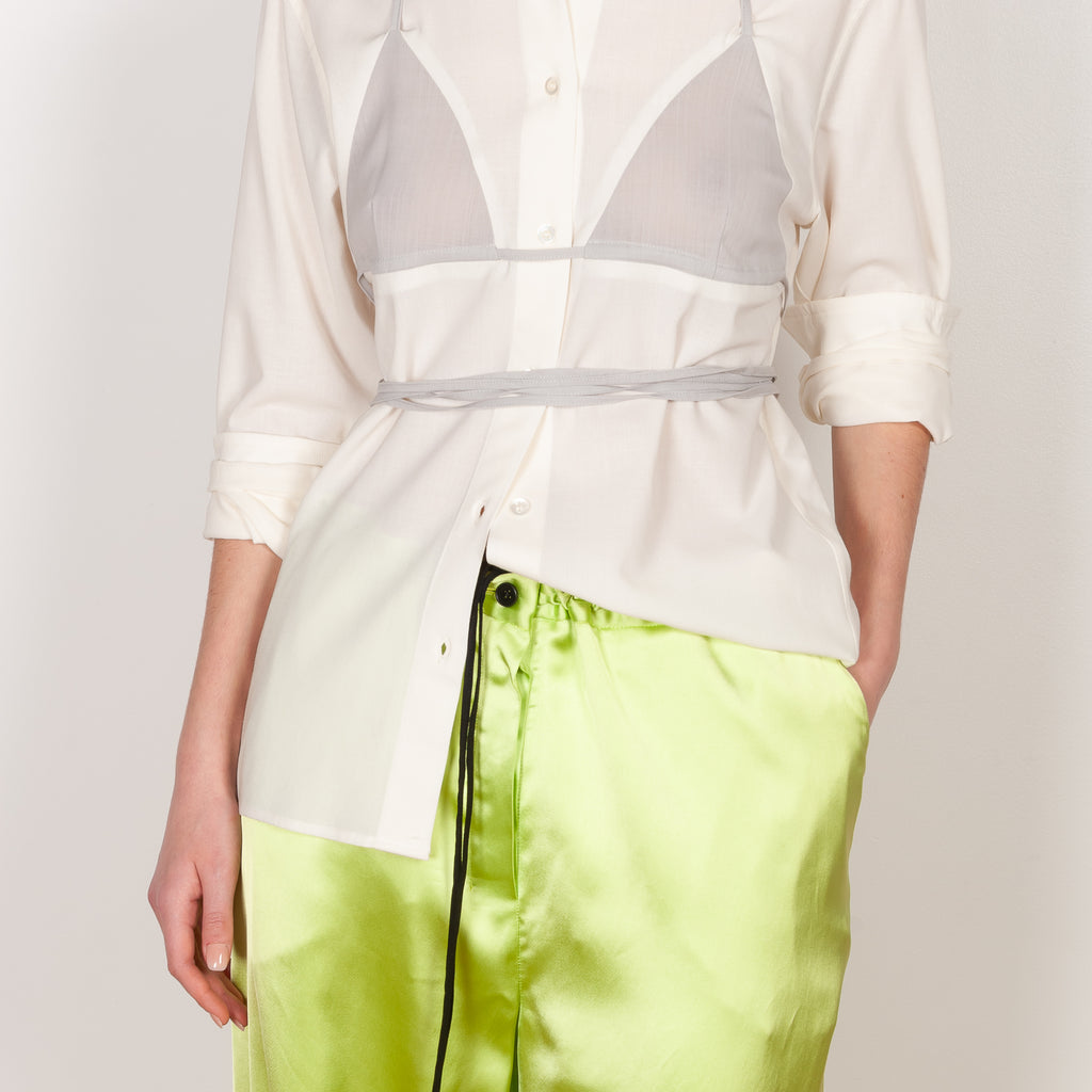 The Bikini Shirt by Botter is a cream shirt with a integrated bikini detail to tie in the back