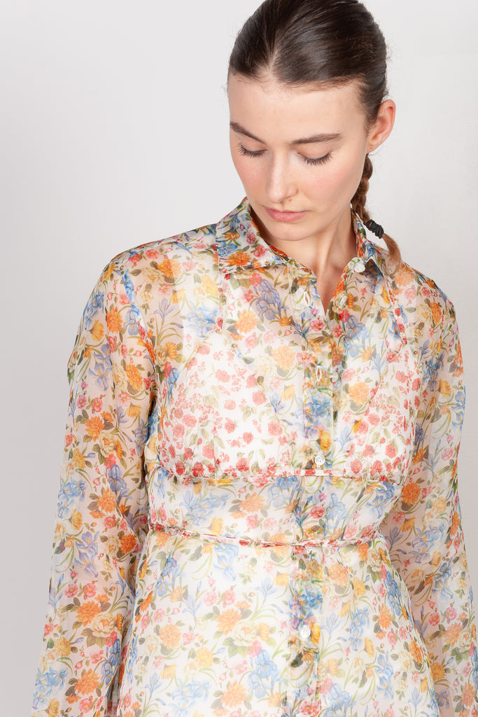 The Bikini Shirt by Botter is a floral silk shirt with a integrated bikini detail to tie in the back