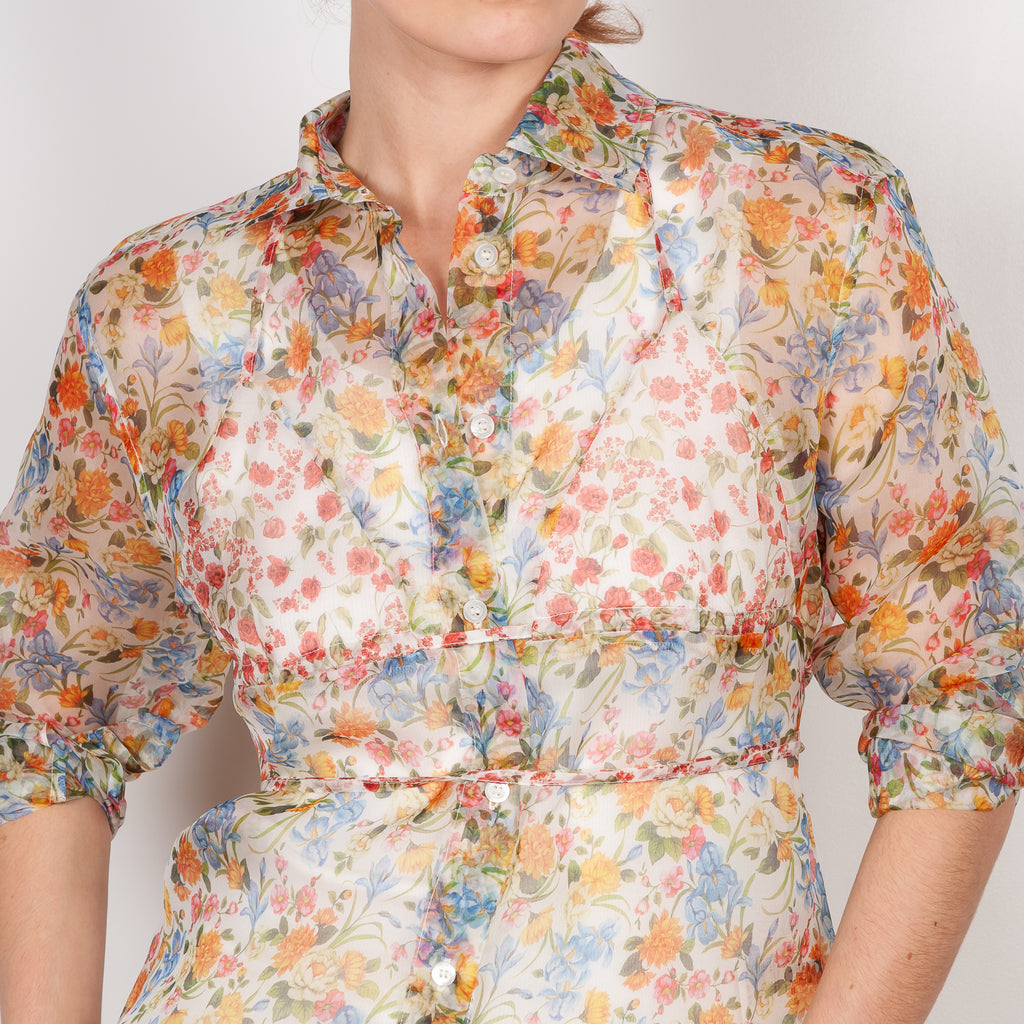 The Bikini Shirt by Botter is a floral silk shirt with a integrated bikini detail to tie in the back