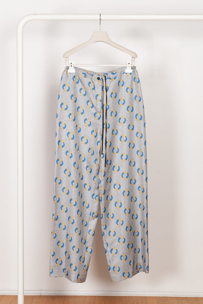 The Pyjama Trousers by Botter are relaxed silk trousers with a seasonal fish print