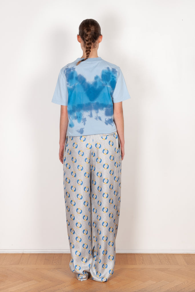The Pyjama Trousers by Botter are relaxed silk trousers with a seasonal fish print