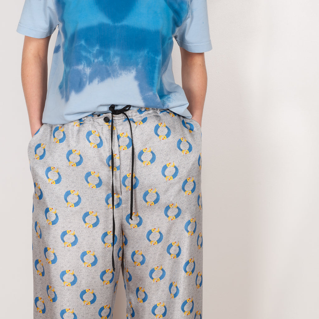 The Pyjama Trousers by Botter are relaxed silk trousers with a seasonal fish print