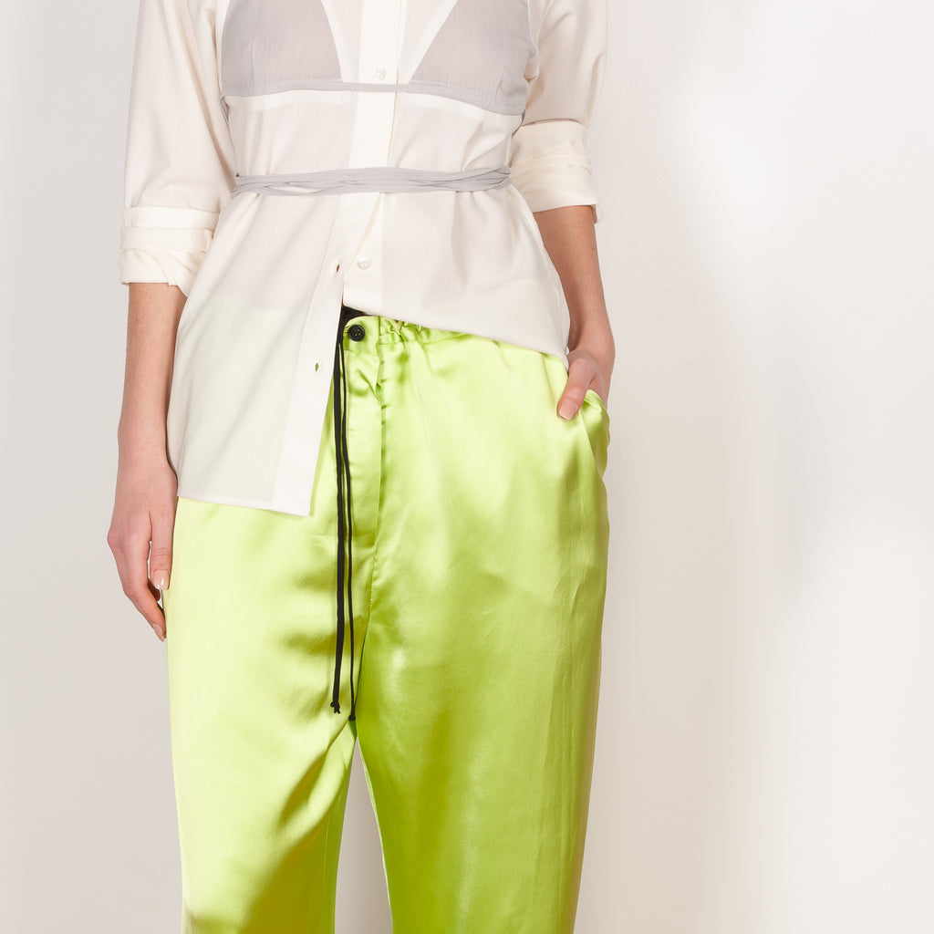 The Pyjama Trousers by Botter are relaxed silk drawstring trousers in a vibrant lime color