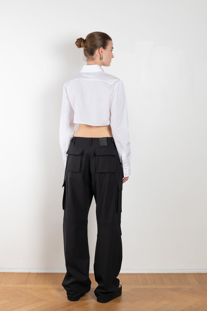 The Cropped Shirt by Coperni is a signature shirt in a crisp cotton with a small silver Coperni button detail