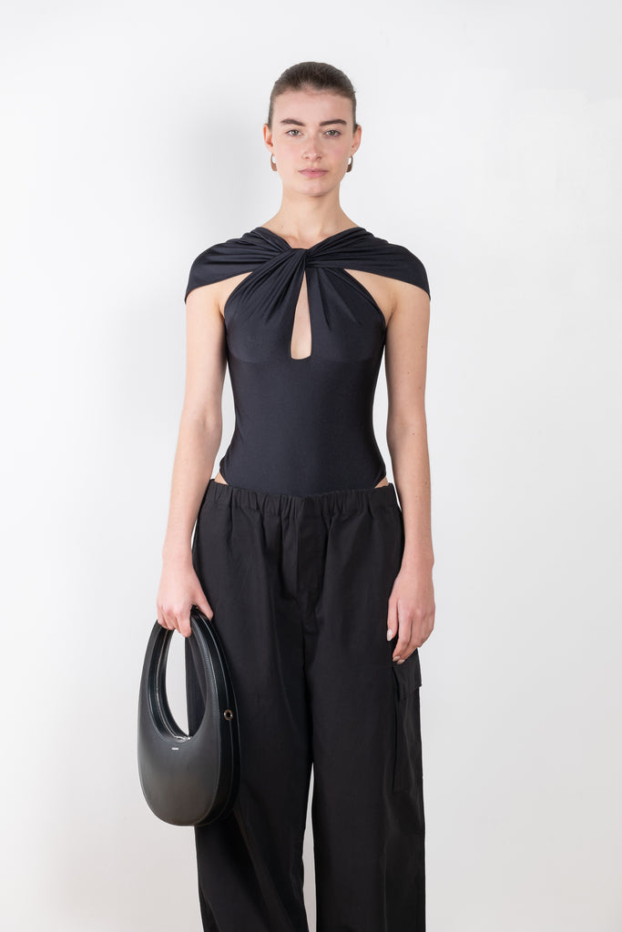 The Cut Out Jersey Bodysuit by Coperni is a signature bodysuit with cut outs and a twisted neckline