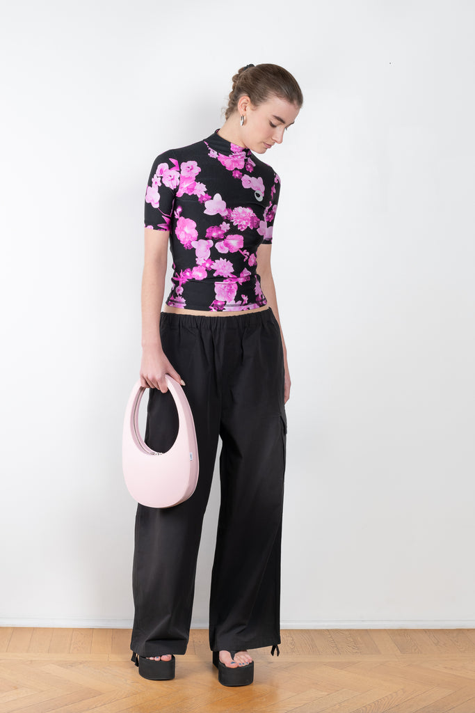 The High Neck Fitted Top by Coperni is a signature fitted top in a pink floral print with a silver C Logo on the chest
