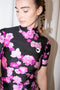The High Neck Fitted Top by Coperni is a signature fitted top in a pink floral print with a silver C Logo on the chest