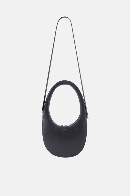 The Crossbody Swipe Bag by Coperni is Coperni's classic oval-shaped bag with an addition of a detachable strap