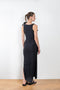 The Asymmetric Flower Gown by Coperni is a signature stretch black dress with cut outs and flower embellishments