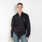 The Body Poplin Shirt by Coperni is a crisp cotton shirt with logo patch and body details