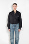 The Body Poplin Shirt by Coperni is a crisp cotton shirt with logo patch and body details