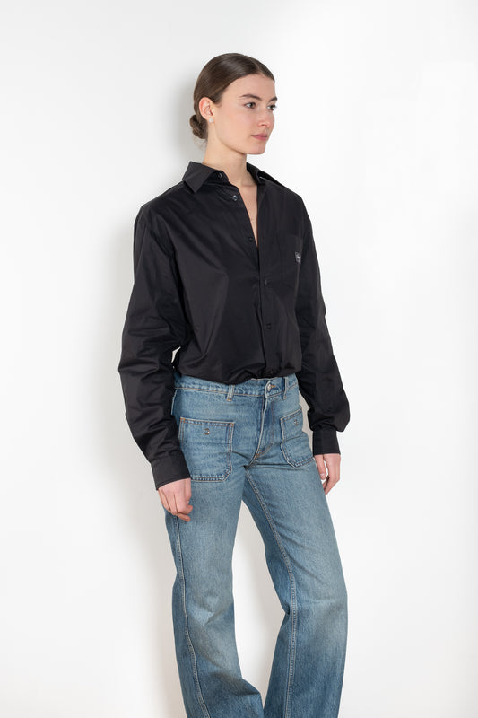 The Body Poplin Shirt by Coperni is a crisp cotton shirt with logo patch and body details