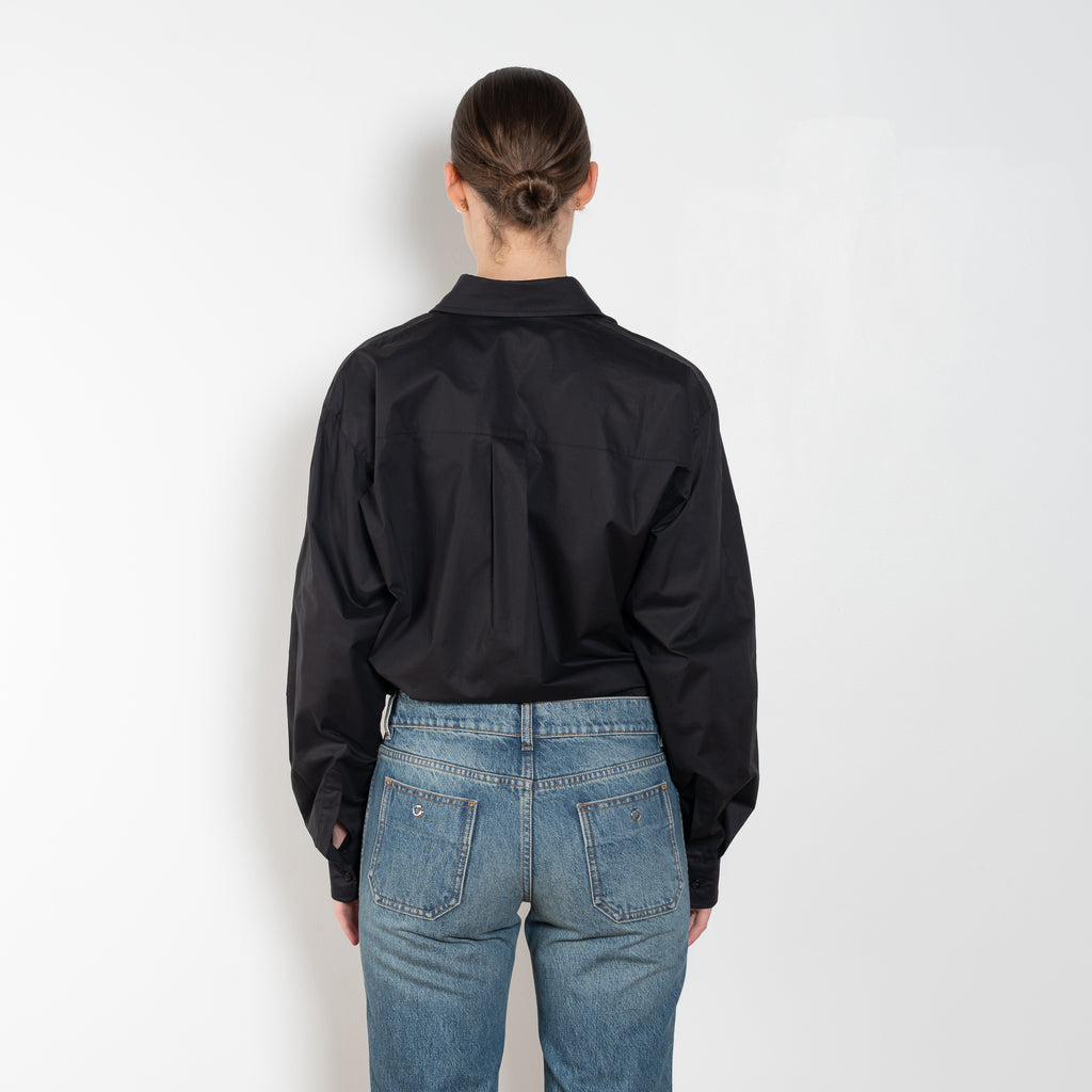 The Body Poplin Shirt by Coperni is a crisp cotton shirt with logo patch and body details