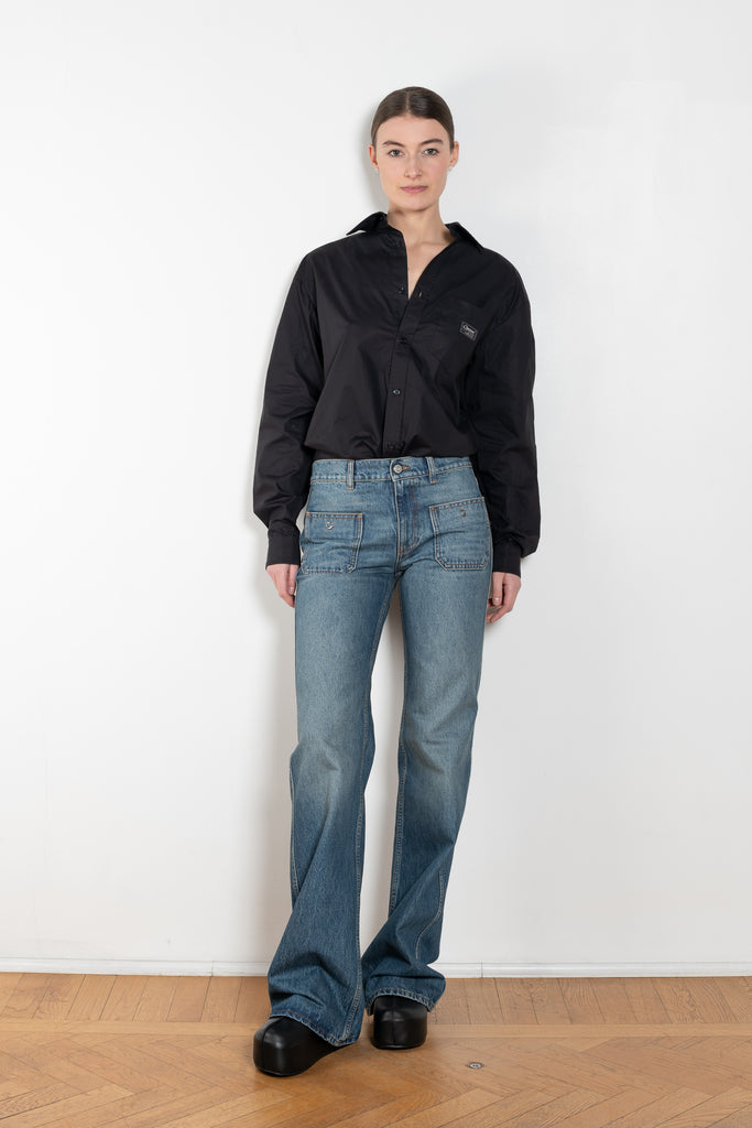 The Body Poplin Shirt by Coperni is a crisp cotton shirt with logo patch and body details