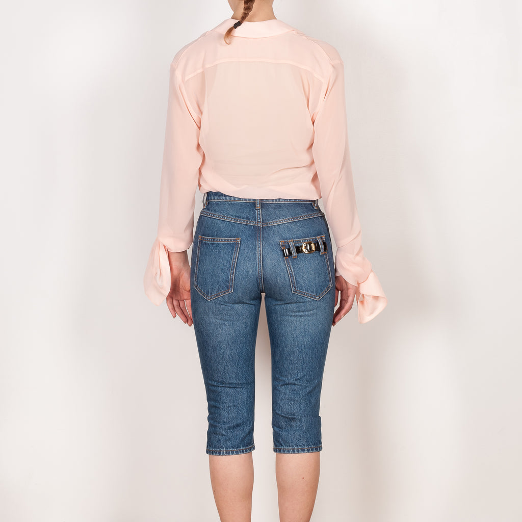 The Cropped Denim Pants by Coperni are high waisted knee length pants with a very fitted silhouette