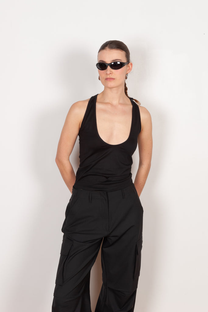 The Deep Cut Tank Top by Coperni is a fitted tank top with a deep cut at the frontThe Deep Cut Tank Top by Coperni is a fitted tank top with a deep cut at the front