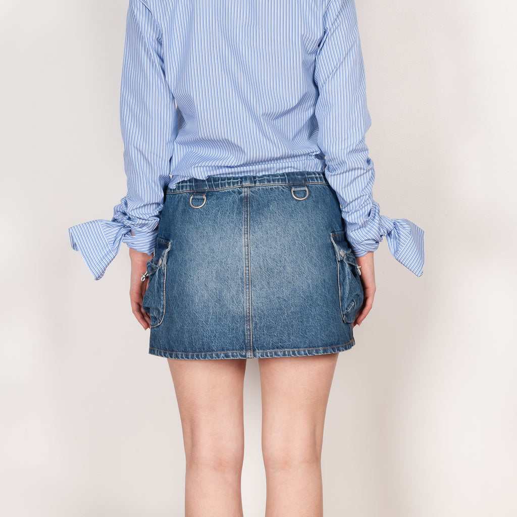 The Denim Cargo Skirt by Coperni are low waisted mini skirts with a signature cargo details