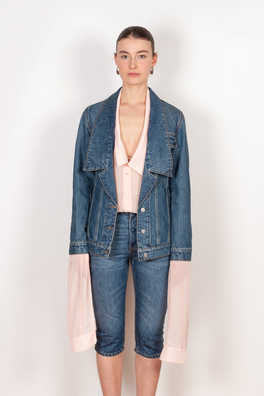 The Denim Jacket by Coperni is a take on the classic denim jacket with a deep open collar