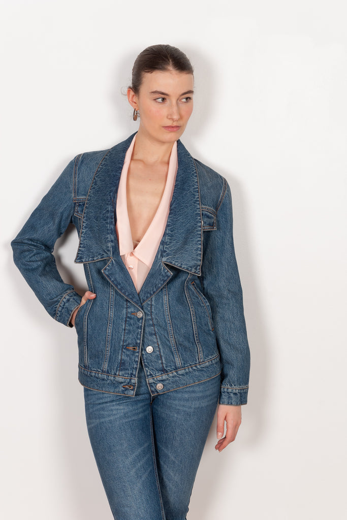The Denim Jacket by Coperni is a take on the classic denim jacket with a deep open collar